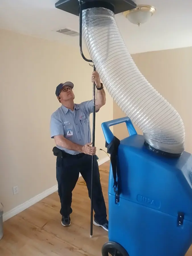 Furnace Tune-Up technician using HEPA equipment in Oakbrook